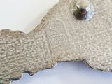 a metal object that is shaped like a fish