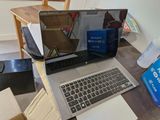a laptop computer sitting on top of a wooden desk