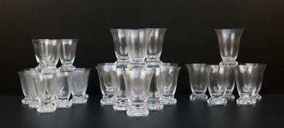 a lot of glasses that are sitting on a table