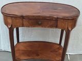 a wooden table with a shelf on top of it