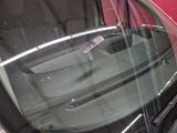 a close up of a car ' s windshield with a sticker on it