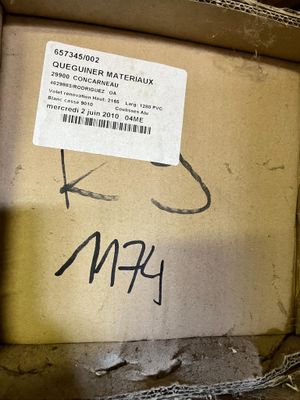 a box that has a tag on it with a sticker on it