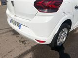 a white car that is parked in a parking lot