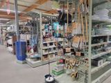 many shelves in the store that have various items on them