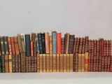 many old books stacked on top of each other