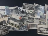 many old postcards of people and buildings on the table