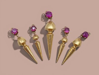 three pairs of gold and amethorate earrings with pink stones