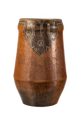 a brown vase with a heart on it on a white background