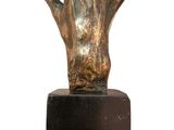 sculpture of a bronze hand on a black marble base