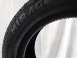 a close up of a tire on a white surface
