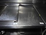 a kitchen with stainless steel counter tops and a sink