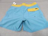 a close up of a pair of blue and yellow swim shorts
