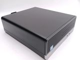 an image of a small black computer on a white surface