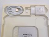 a white box with a charger and a charger on it