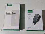 two boxes of power bank sitting on a table next to each other