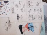 a lot of drawings and pictures on the table