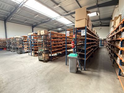 a large warehouse filled with lots of shelves and pallets