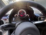 a close up of a steering wheel and dashboard of a car