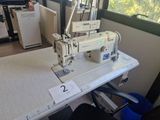 an image of a sewing machine on a table in a room