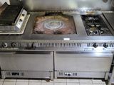 a large stove with two burners and a stove top