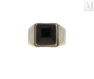 an image of a ring with a black stone in it