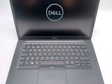 the dell laptop is open and ready to be used