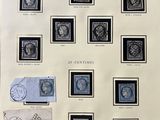 an old picture of a collection of stamps and stamps on display