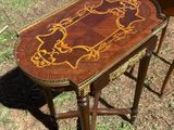 pair of antique wooden side tables with painted designs on them