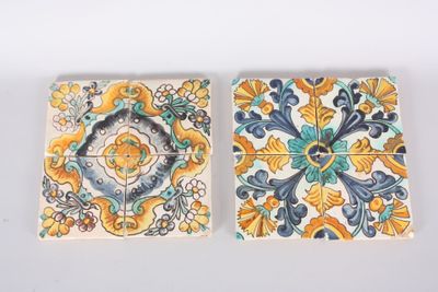 pair of tiles with floral designs on them on a white surface