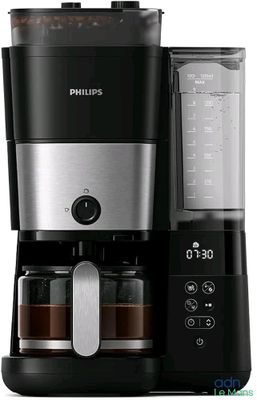 a black and silver coffee maker with a blender on it