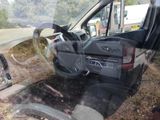 a picture of a car that is sitting in the grass