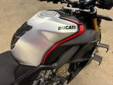 a close up of a motorcycle parked in a parking lot