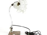 a lamp that has a flower on top of it