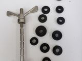 a lot of screws and screws on a white surface