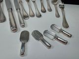 a lot of silver spoons and knives on the table
