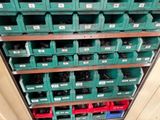 many green bins on the shelves in the room
