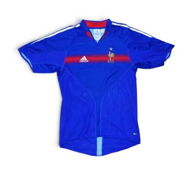 a close up of a blue shirt with a red and white stripe