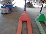 a forklift sitting in the middle of a garage