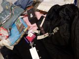 a suitcase full of clothes and other items on the floor