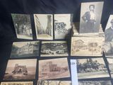 many old postcards that are sitting on a table