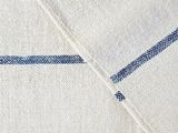 a close up of a white shirt with a blue stripe on it