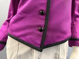 purple jacket with black trim and buttons on a mannequin mannequin mannequin mannequin mannequin mannequin mannequin manne