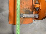 a measuring tape attached to a piece of metal