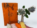 five different ties and a vase of flowers on the table