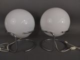 two lamps that are sitting on a table