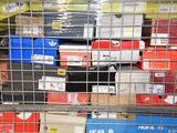 many boxes of electronic devices in a metal cage