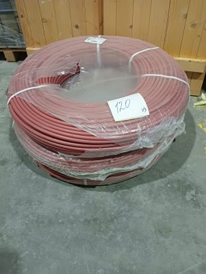 a roll of red wire wrapped in plastic on the floor