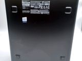 a close up of a black laptop computer on a white surface