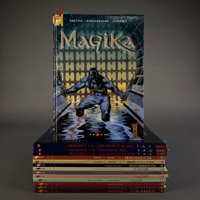 books stacked on top of each other on a gray surface