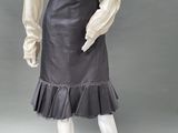 an image of a mannequin wearing a black skirt and white shirt